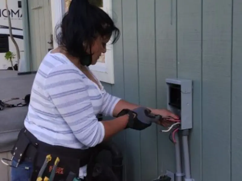 Licensed electrician wiring an exterior subpanel in Union